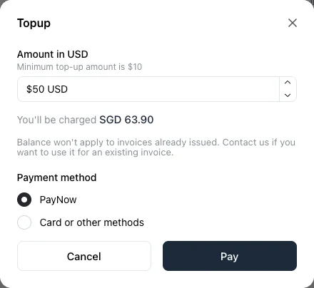 The Topup window with $50 USD entered, You'll be charged SGD 63.90, and PayNow selected as the payment method