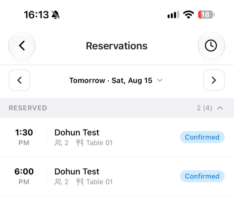 A day of reservations in the mobile app, each row showing time, guest name, party size, table and status